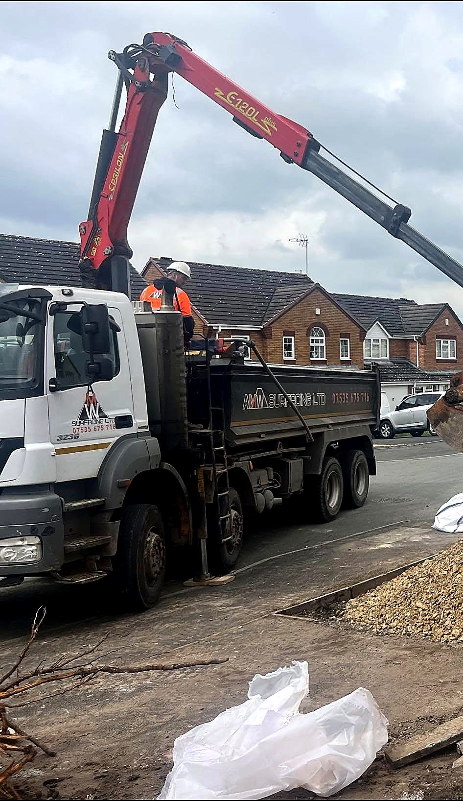 AMW Surfacing Ltd crane truck at work