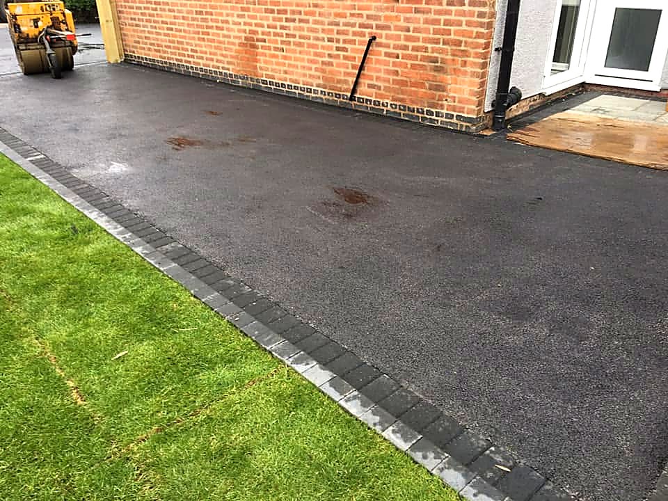 Residential tarmac driveway with neat edging