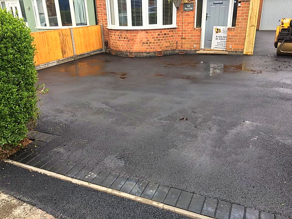 Freshly laid driveway surface after rain